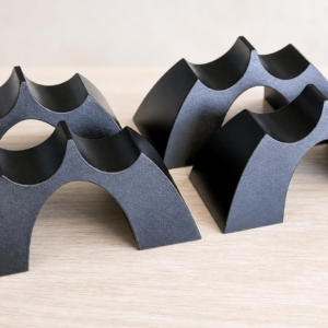 Four Cable Arch Duo supports arranged on a light product-page background for paired speaker cable routing.