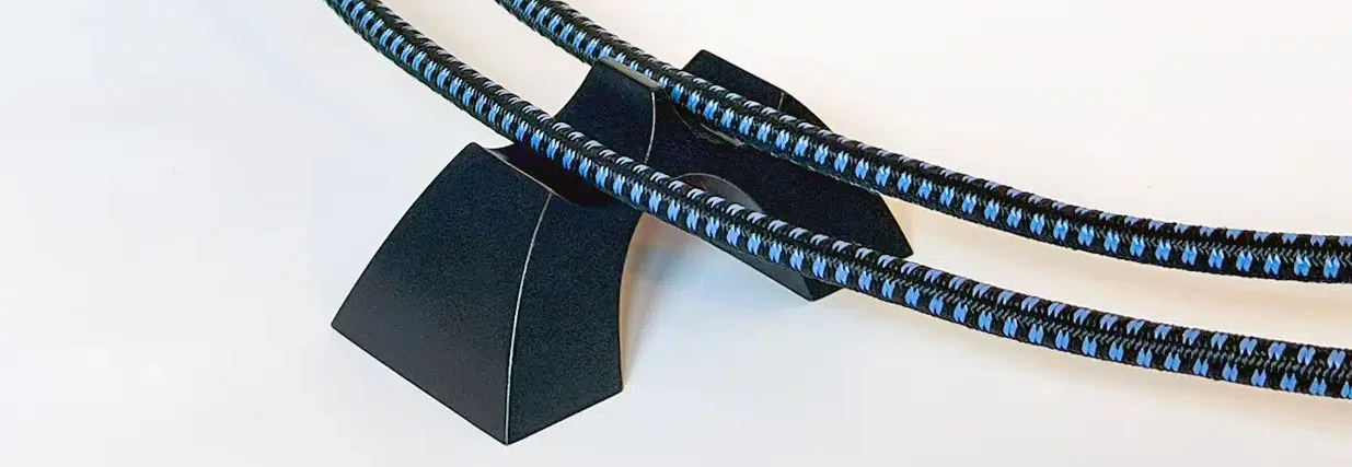 Cable Arch™ Duo dual-channel speaker cable elevator supporting two parallel speaker cables